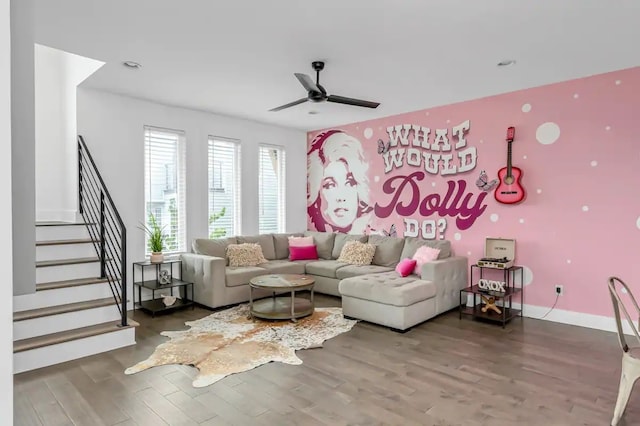 living room with hardwood / wood-style flooring and ceiling fan