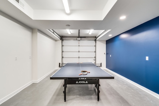 recreation room featuring concrete floors