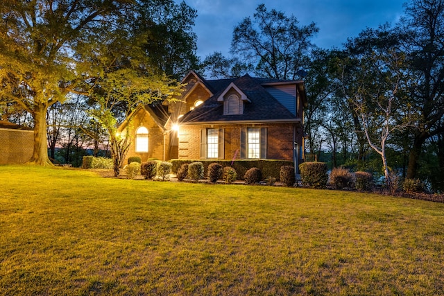 view of front of home with a lawn