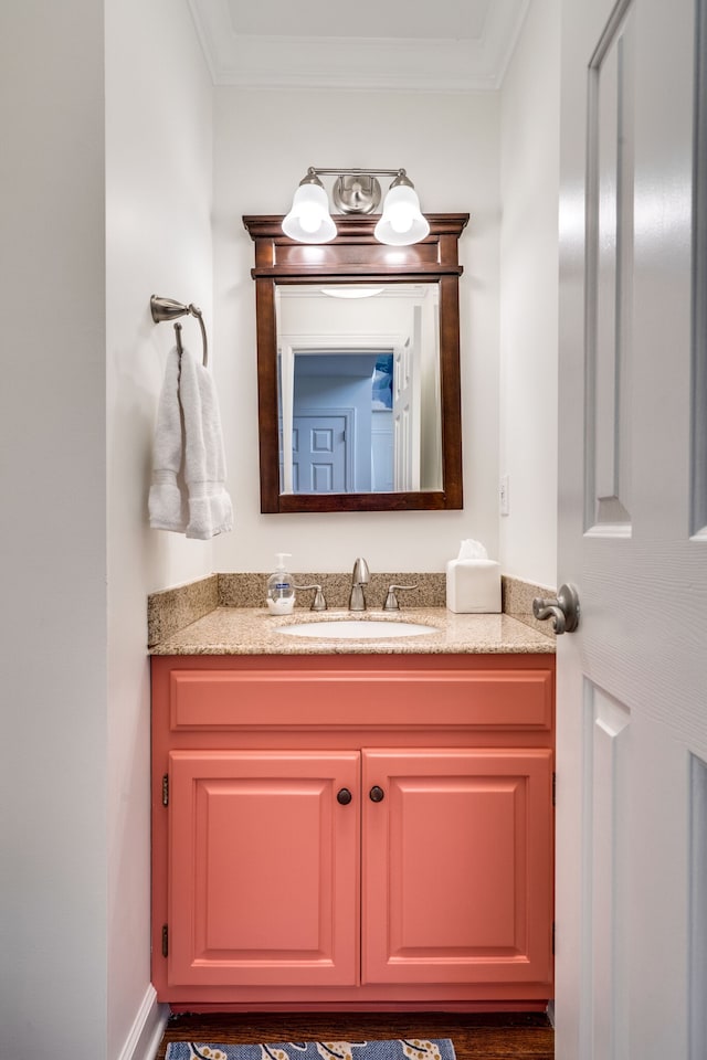 bathroom with vanity and crown molding