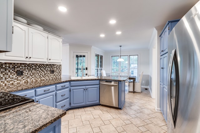 kitchen with stainless steel appliances, white cabinets, and blue cabinets