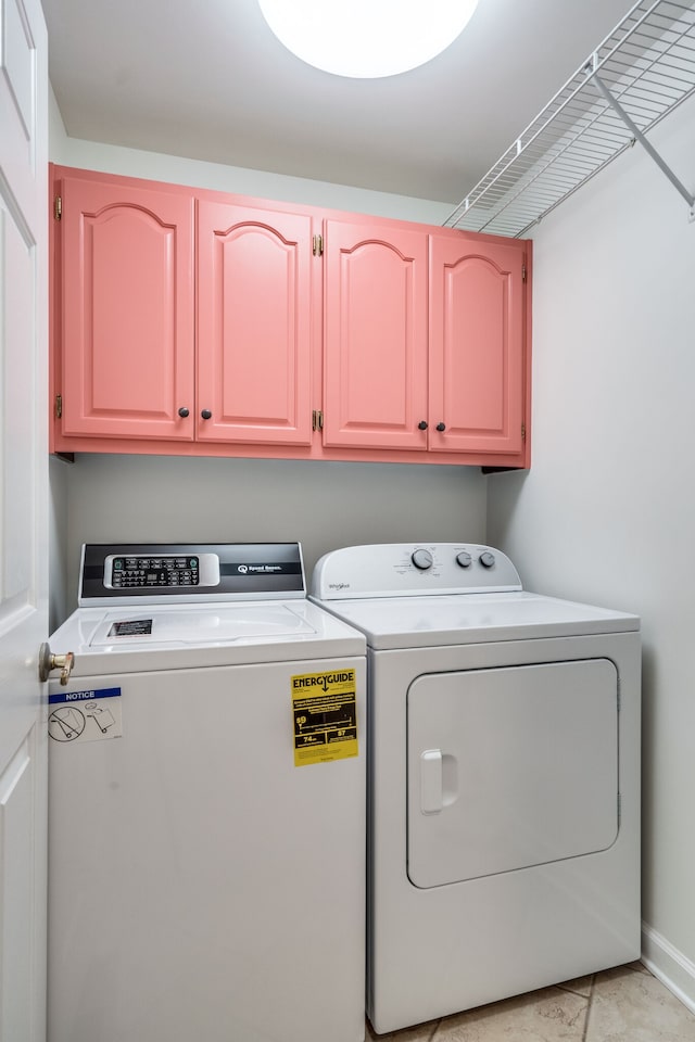 laundry area with cabinets and independent washer and dryer