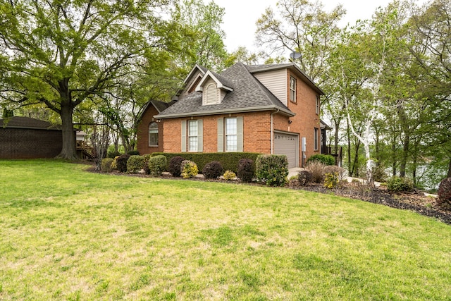 view of side of property featuring a garage and a yard