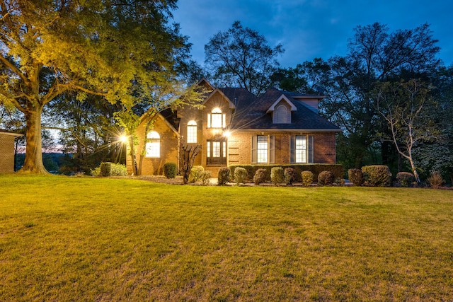 view of front of house with a yard