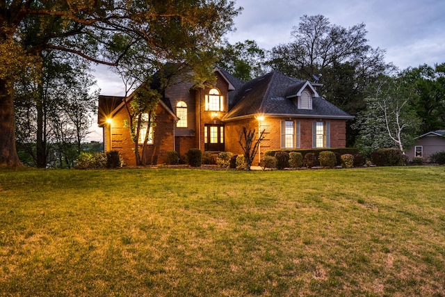 view of front of property with a yard