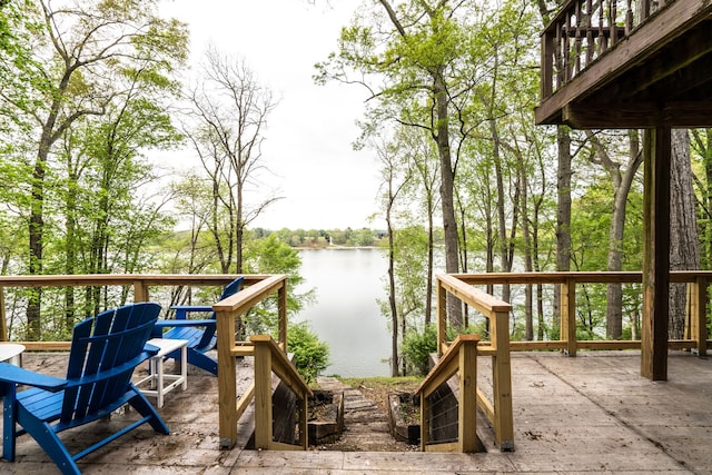 wooden terrace featuring a water view