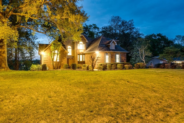 view of front of home with a yard