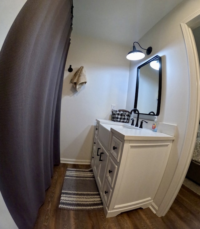 bathroom with vanity and wood-type flooring