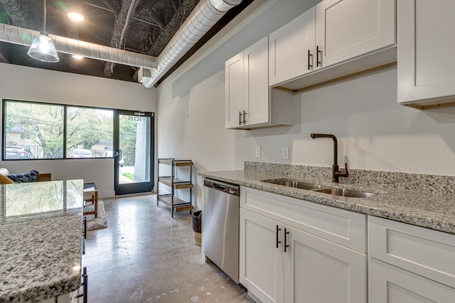 kitchen with dishwasher, light stone countertops, sink, and white cabinets