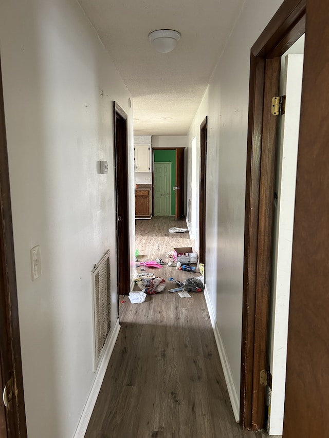 corridor featuring hardwood / wood-style flooring