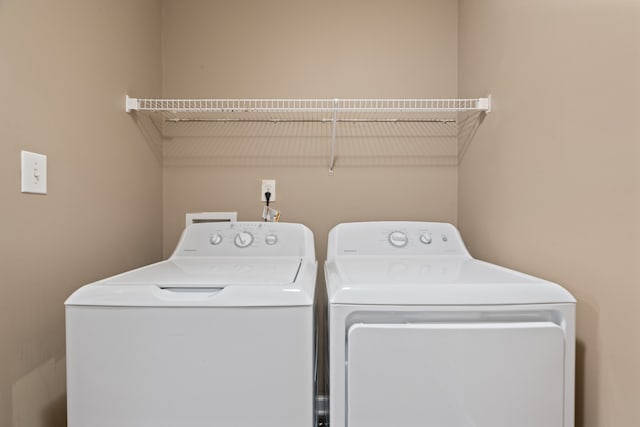 laundry room with washer and clothes dryer