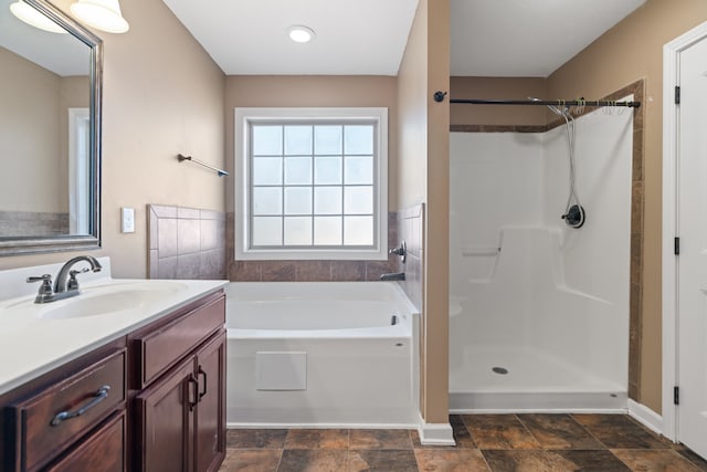 bathroom with plus walk in shower and vanity