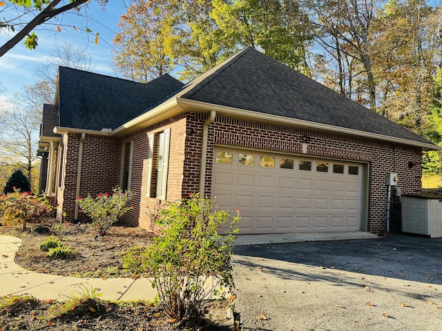 view of side of home with a garage