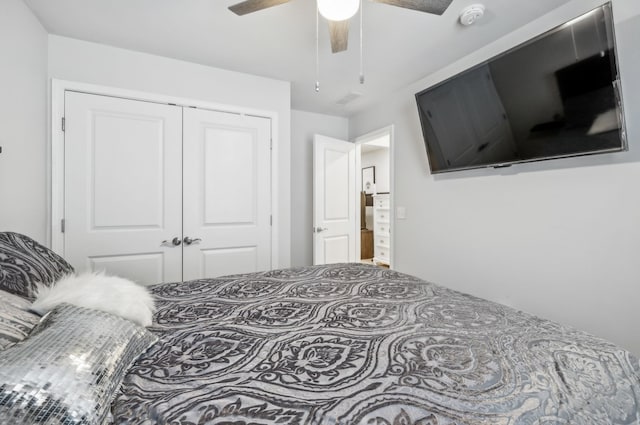 bedroom with ceiling fan and a closet