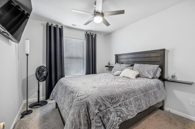 bedroom featuring ceiling fan and carpet