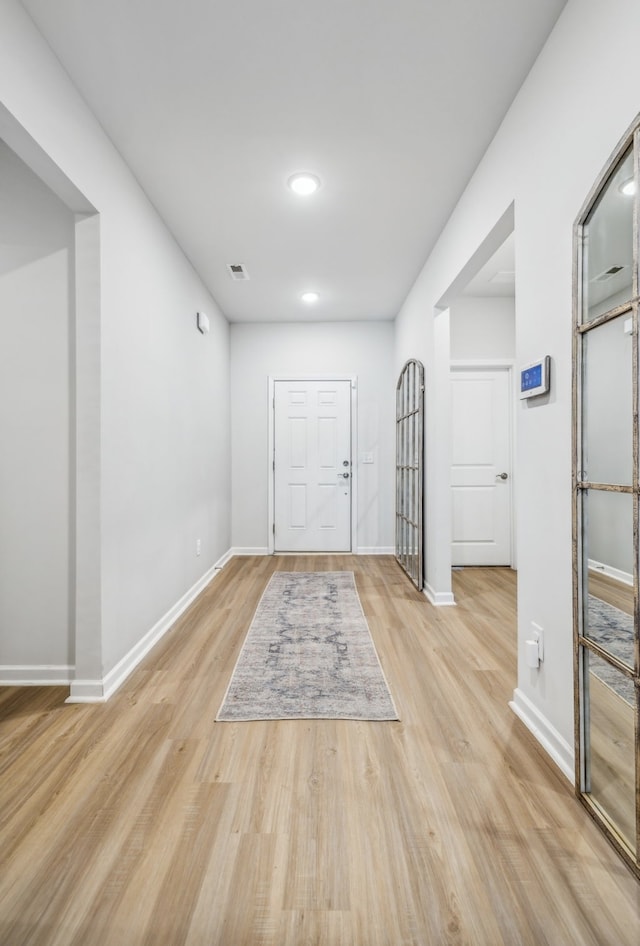 foyer with light hardwood / wood-style flooring