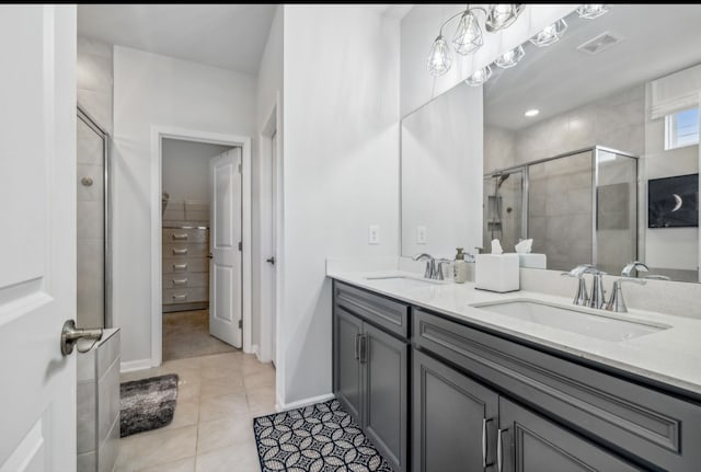 bathroom featuring vanity, walk in shower, and tile patterned floors