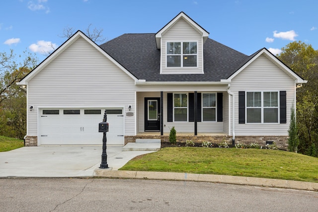 view of front of house featuring a garage and a front lawn