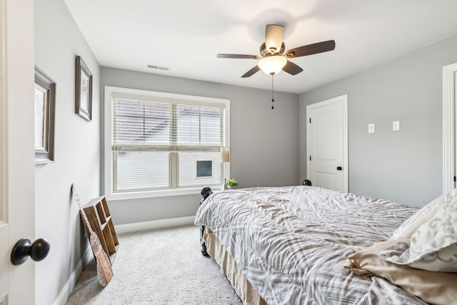 bedroom with ceiling fan and light colored carpet