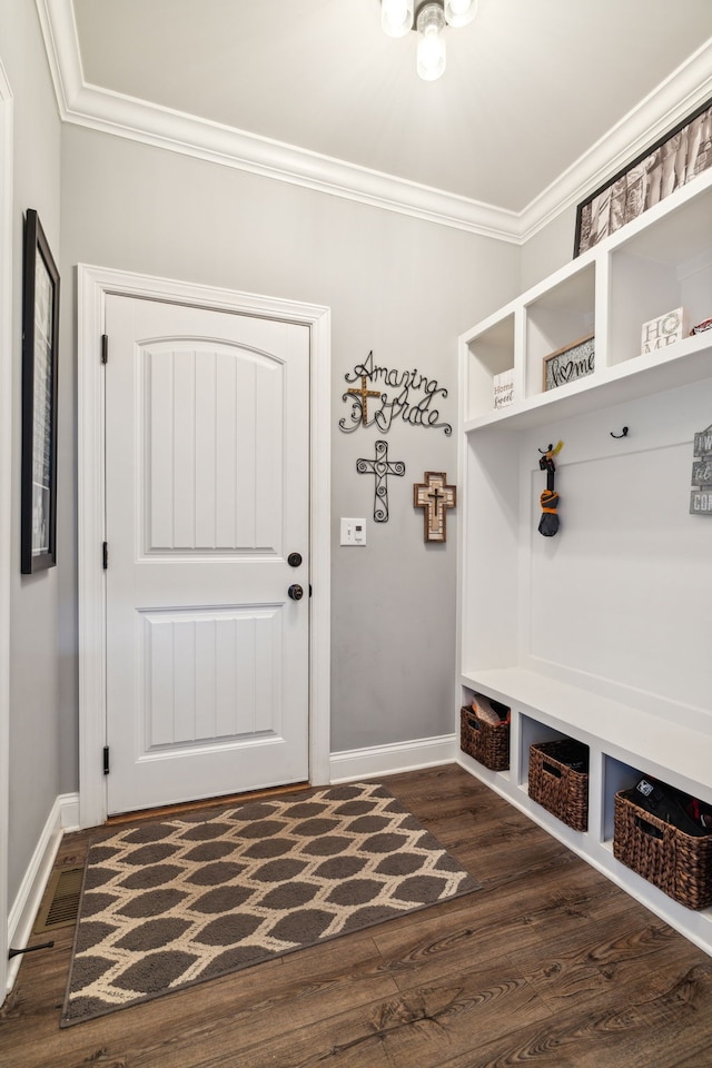 mudroom with dark hardwood / wood-style flooring and ornamental molding