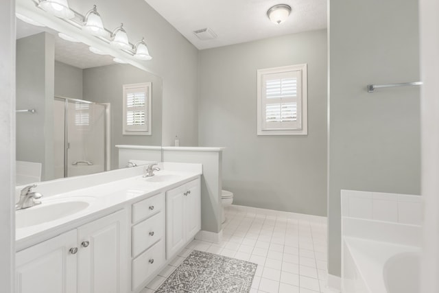 full bathroom with tile patterned flooring, a textured ceiling, vanity, toilet, and separate shower and tub