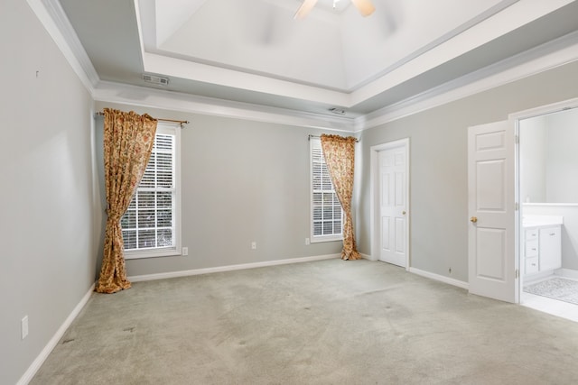 unfurnished bedroom featuring light colored carpet, ceiling fan, and ornamental molding