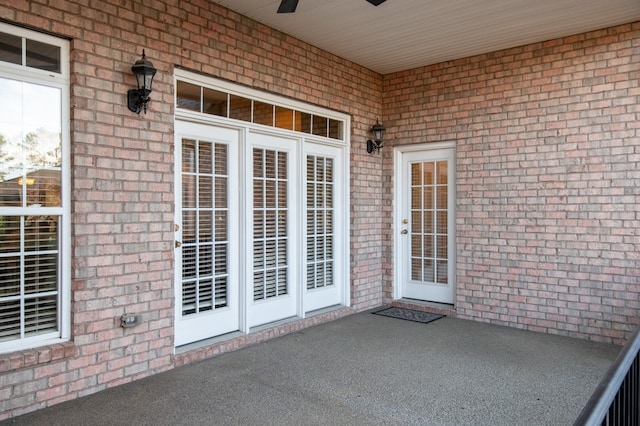 entrance to property featuring ceiling fan