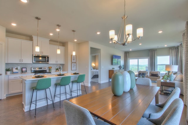 dining room featuring a notable chandelier and dark hardwood / wood-style floors