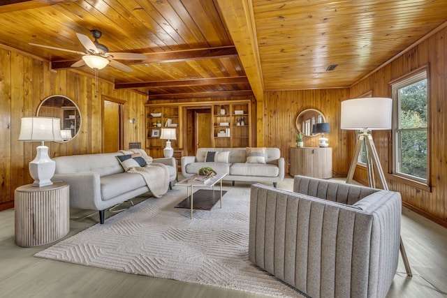 living room with wood walls, wood ceiling, and light hardwood / wood-style flooring