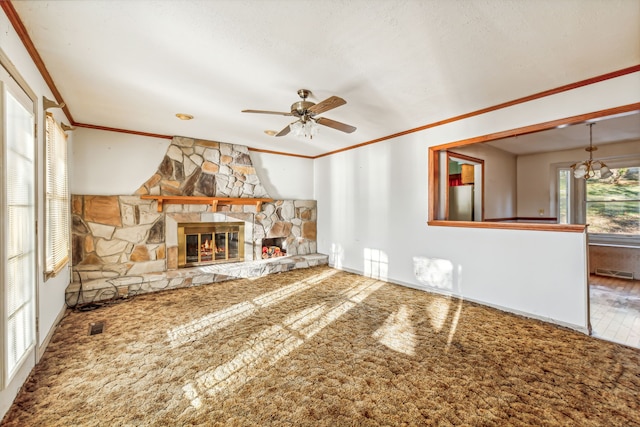 unfurnished living room with a fireplace, ceiling fan, a textured ceiling, and ornamental molding