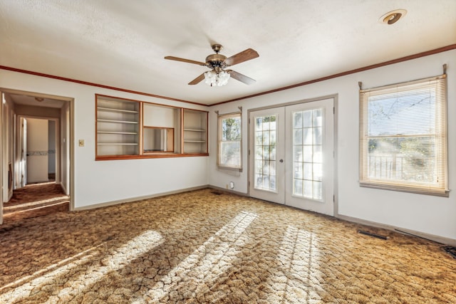 interior space with a textured ceiling, french doors, a healthy amount of sunlight, and ceiling fan