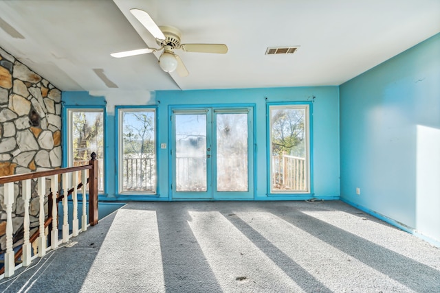 interior space with ceiling fan