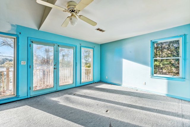 spare room featuring ceiling fan and carpet flooring