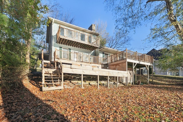 back of house featuring a wooden deck