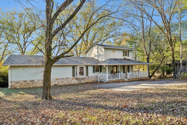 farmhouse inspired home featuring covered porch