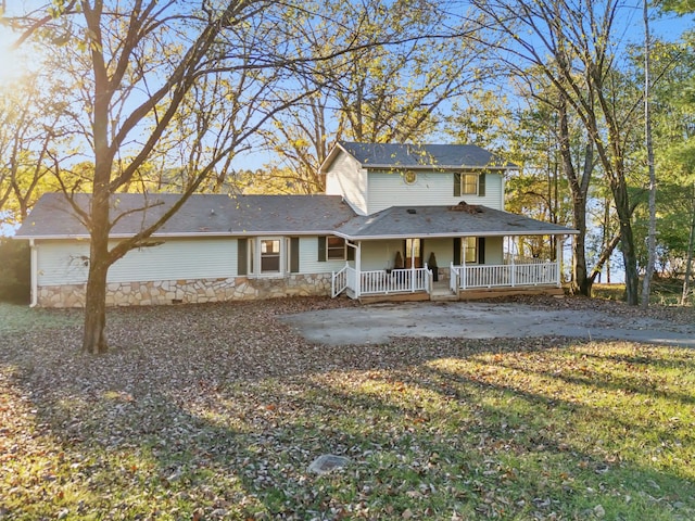 farmhouse featuring covered porch