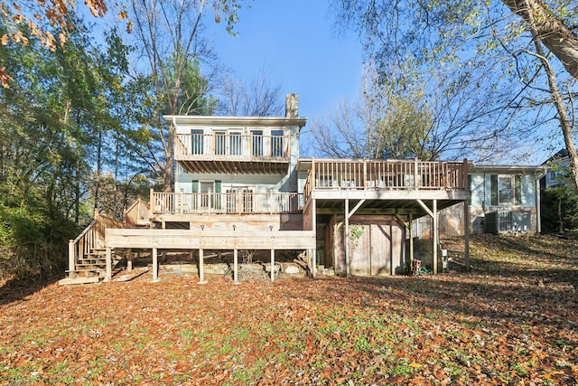 rear view of house featuring a deck