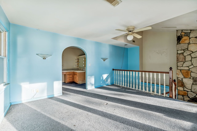 carpeted empty room with ceiling fan