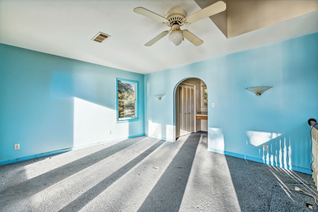 carpeted empty room with ceiling fan