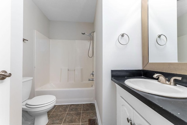 full bathroom with tile patterned flooring, vanity, tub / shower combination, and toilet