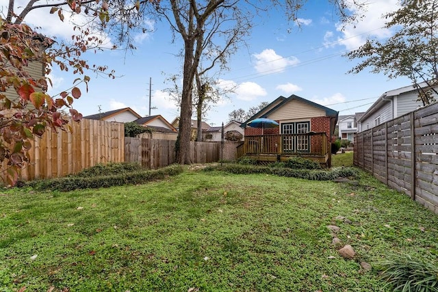 view of yard with a wooden deck