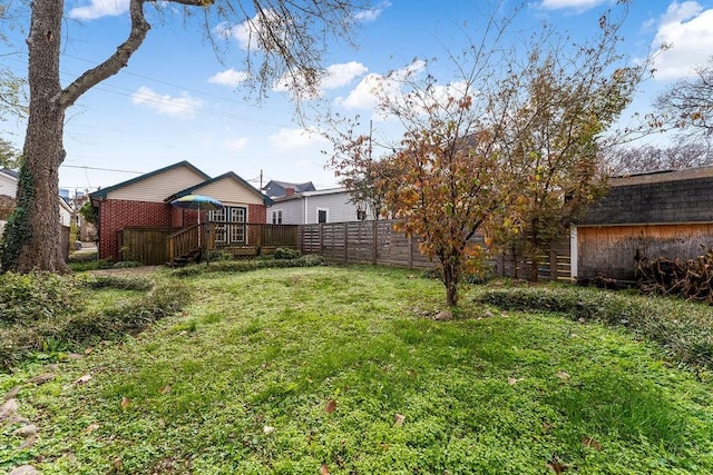 view of yard featuring a wooden deck