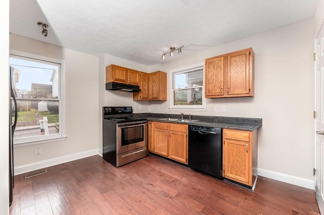 kitchen with stainless steel electric range, a healthy amount of sunlight, dark hardwood / wood-style flooring, and black dishwasher