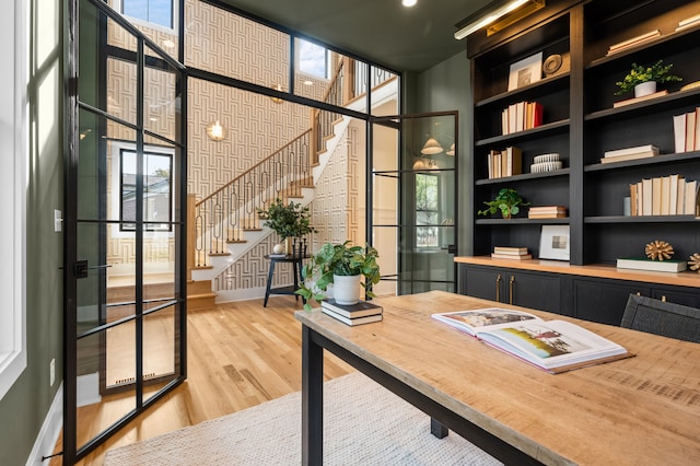 home office with hardwood / wood-style flooring