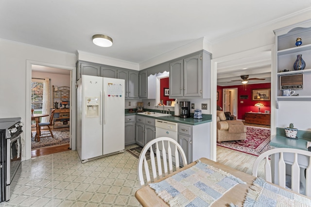 kitchen with gray cabinets, ceiling fan, light hardwood / wood-style floors, and white appliances