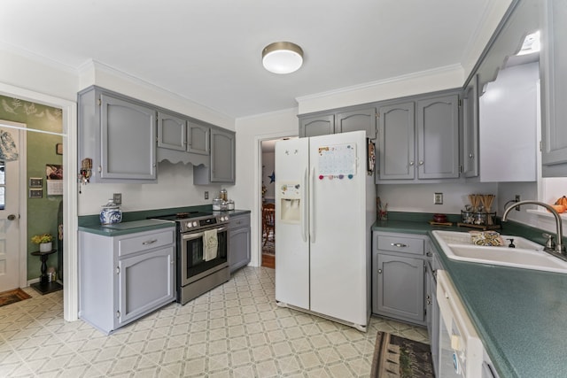 kitchen featuring white appliances, gray cabinets, crown molding, and sink