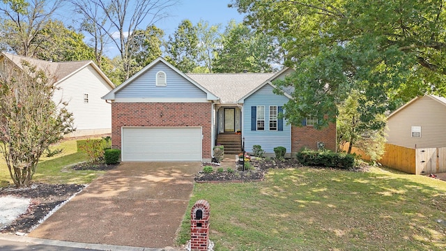 view of front of house with a garage and a front lawn