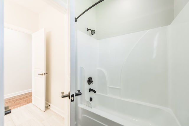 bathroom with shower / bathtub combination and tile patterned flooring