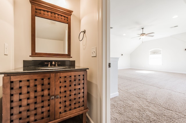 bathroom with vanity, lofted ceiling, and ceiling fan