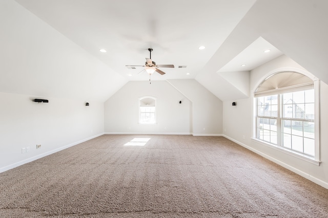 additional living space with ceiling fan, vaulted ceiling, and carpet floors